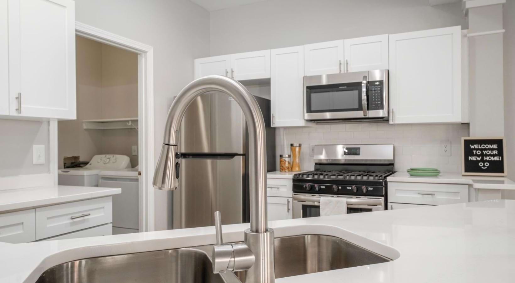 a kitchen with white cabinets