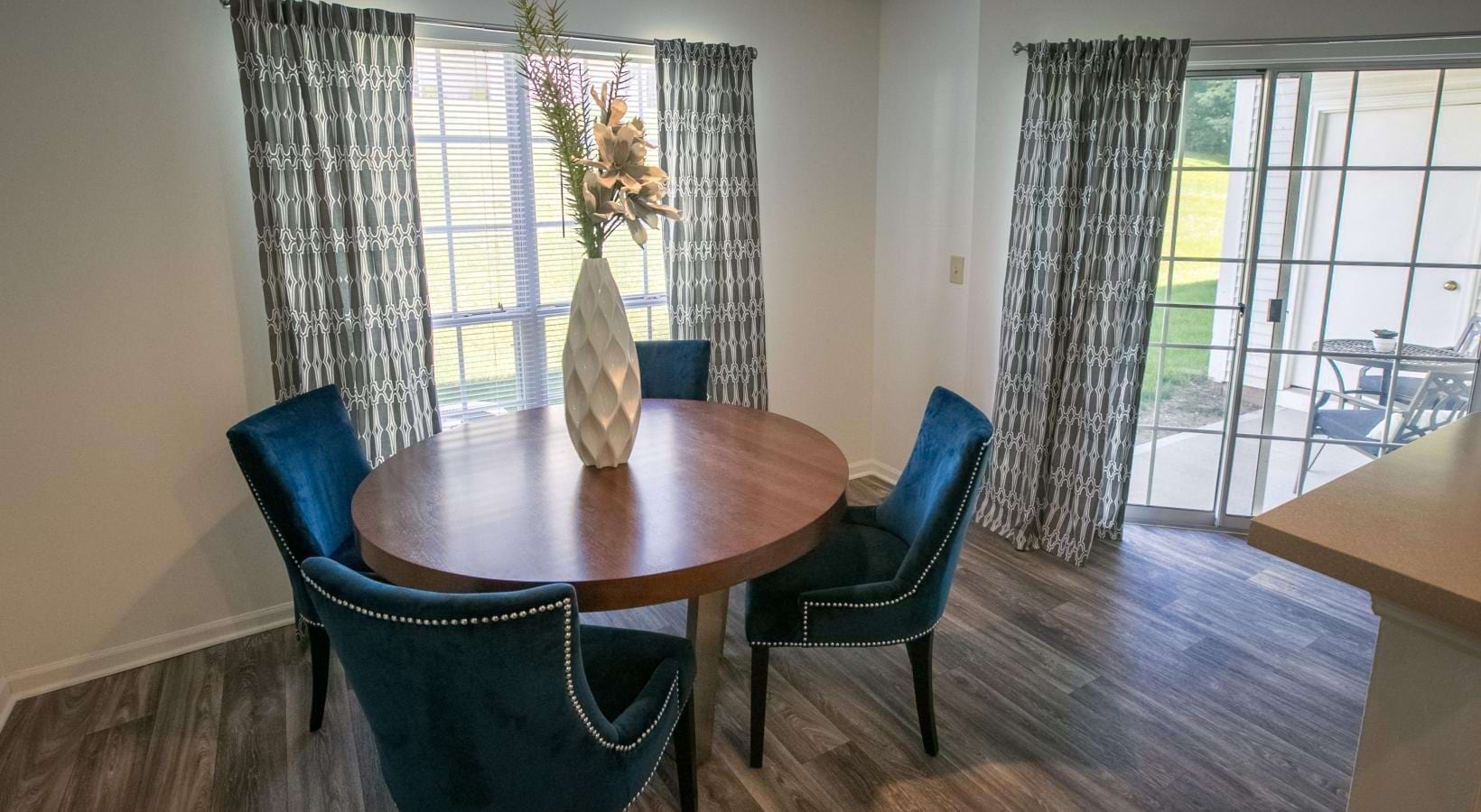 a dining room table with chairs