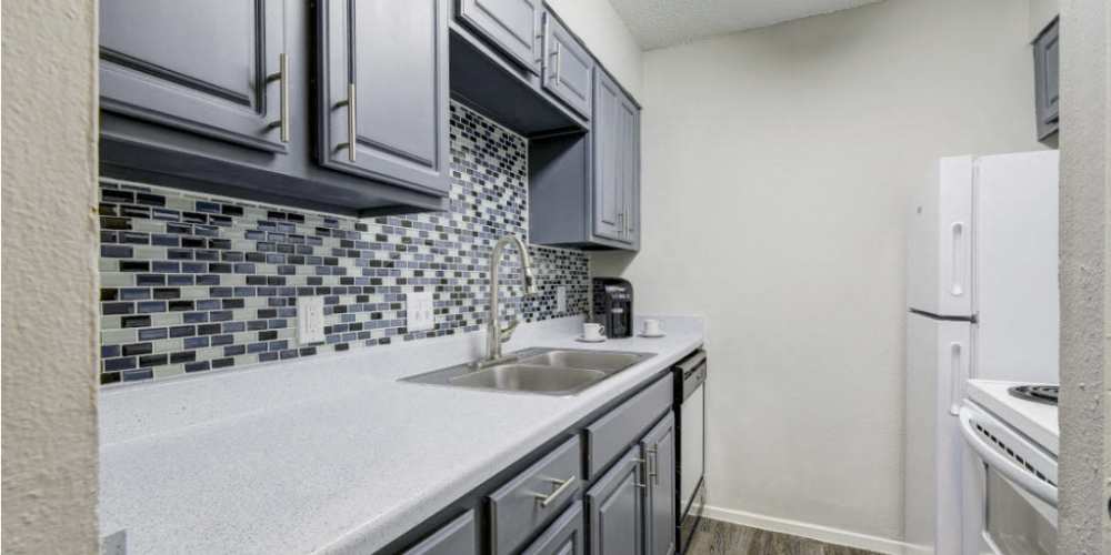 Modern kitchen with grey cabinets at Sangria Park in Austin, Texas