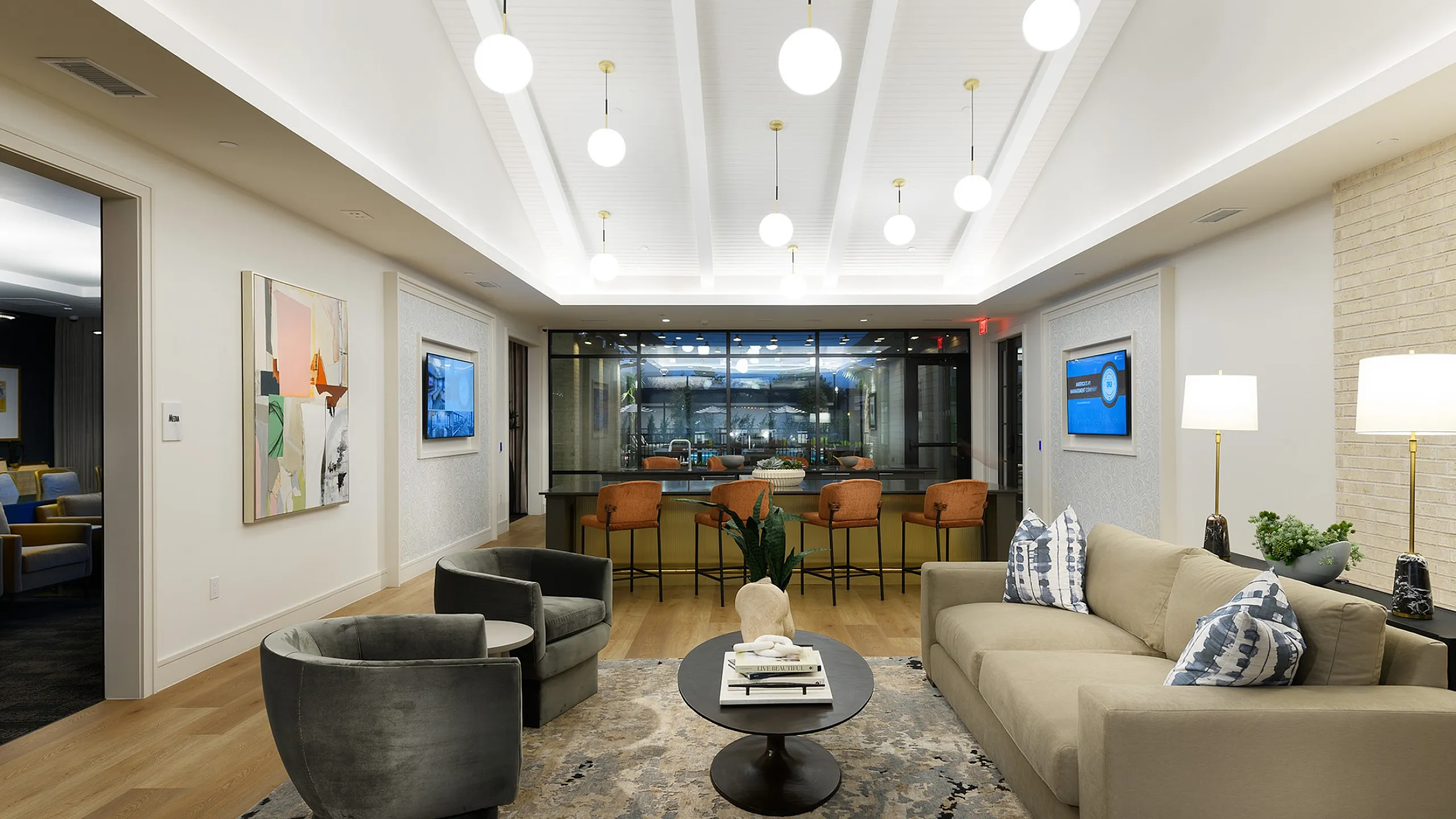Elegant modern living room with stylish furniture, warm lighting, and a vibrant open layout, ideal for entertaining.