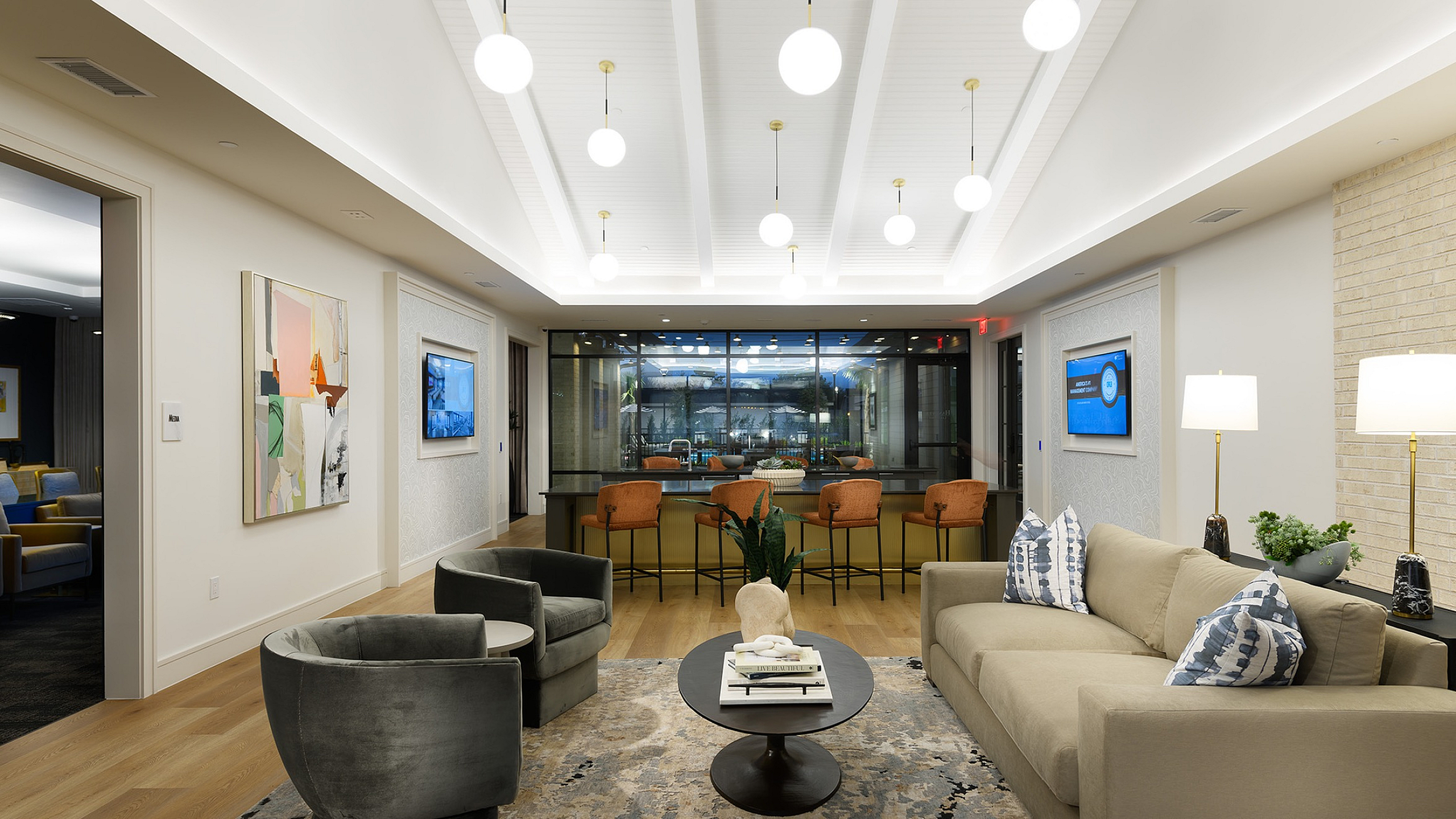 Elegant modern living room with stylish furniture, warm lighting, and a vibrant open layout, ideal for entertaining.