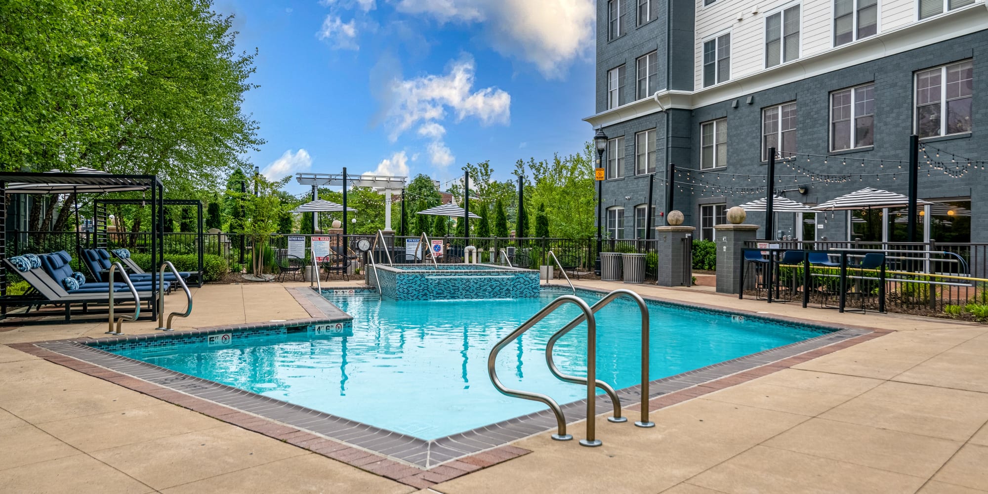 Resort-Style Swimming Pool with Sun Deck at Sofi at Morristown Station in Morristown, New Jersey