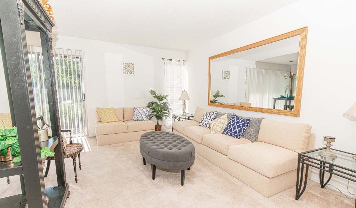 Living room with carpet flooring at Waterford Manors in Manchester, Missouri