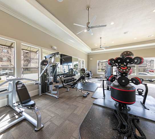 A well-equipped gym with a variety of exercise machines.