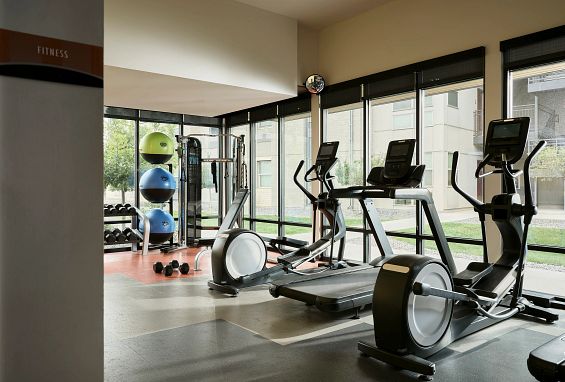 alt="Fitness center with cardio and weight training"
