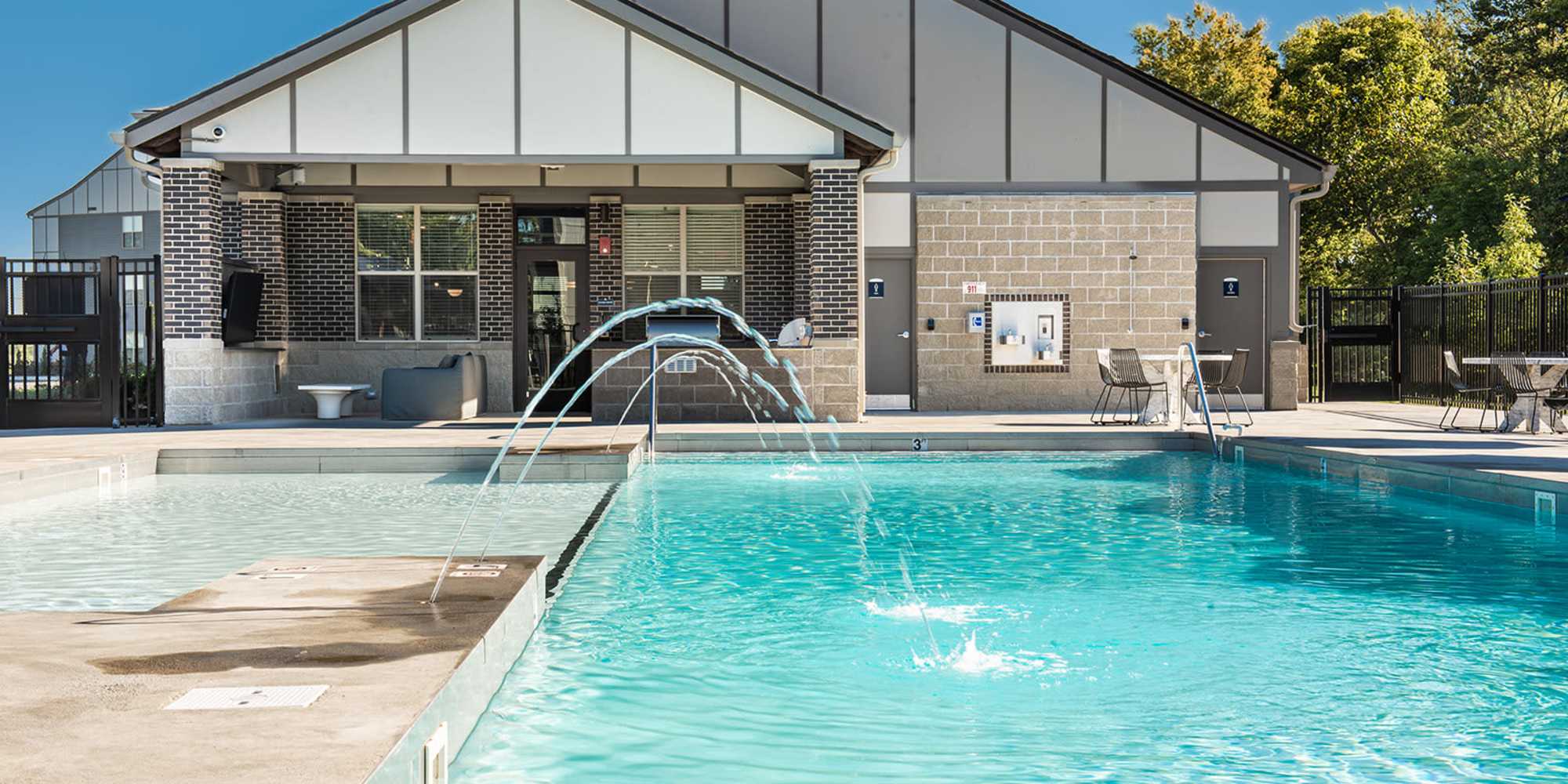 Swimming pool with lounge chairs at Founders Pointe Apartments in Franklin, Indiana