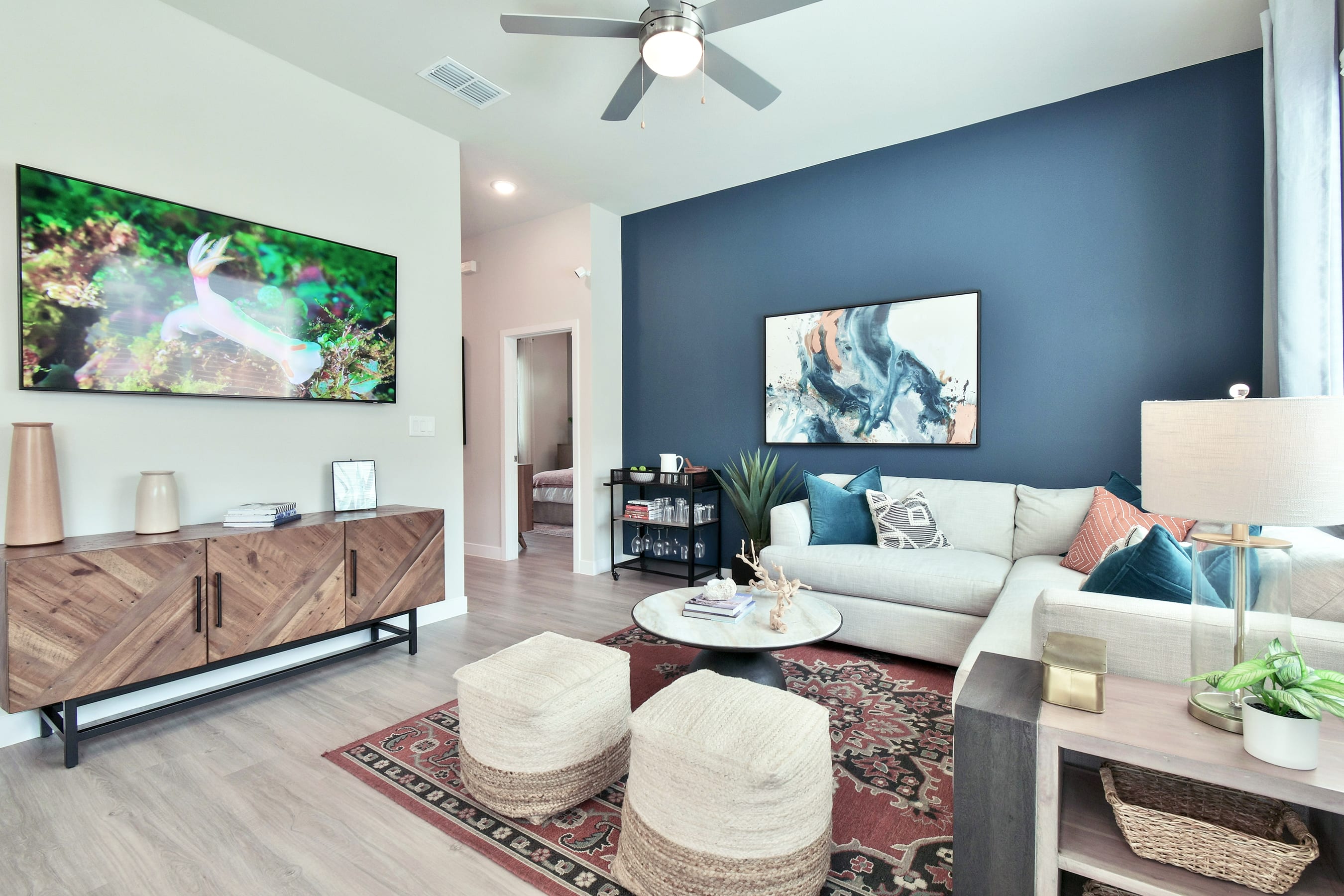 A modern living room with a white couch and a coffee table. at Avilla Berry Creek Highlands  Apartments, Texas, 78633