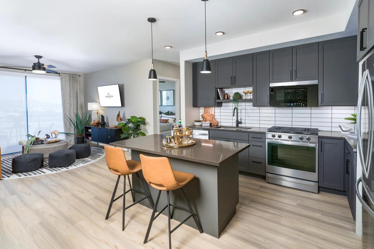 modera scottsdale apartments in scottsdale az kitchen with dark cabinetry and stainless steel appliances