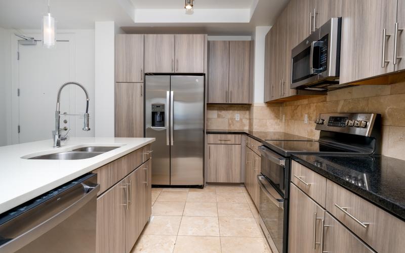 a kitchen with wooden cabinets