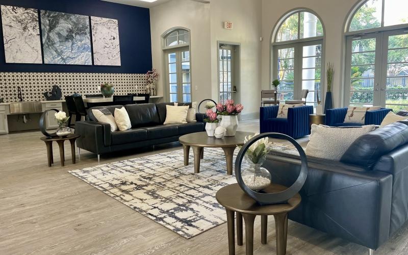 a lounge with a couch and coffee table
