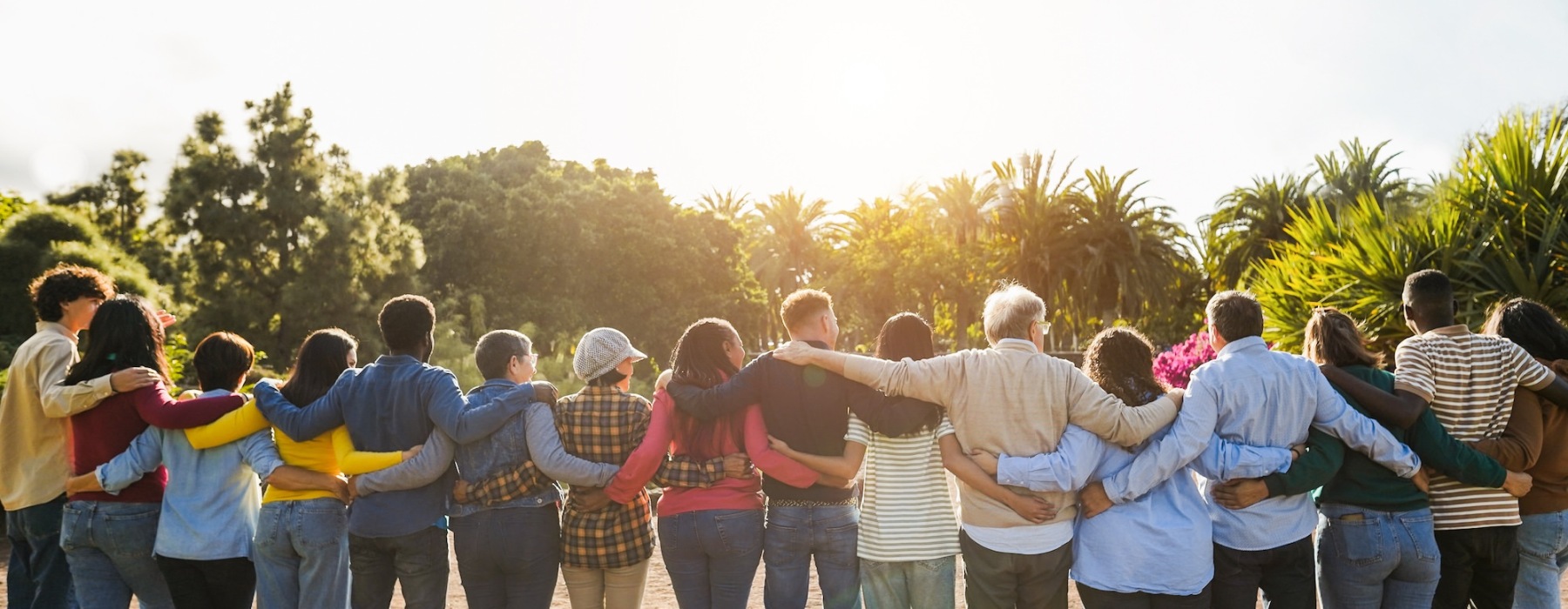 a group of people with their arms around one another