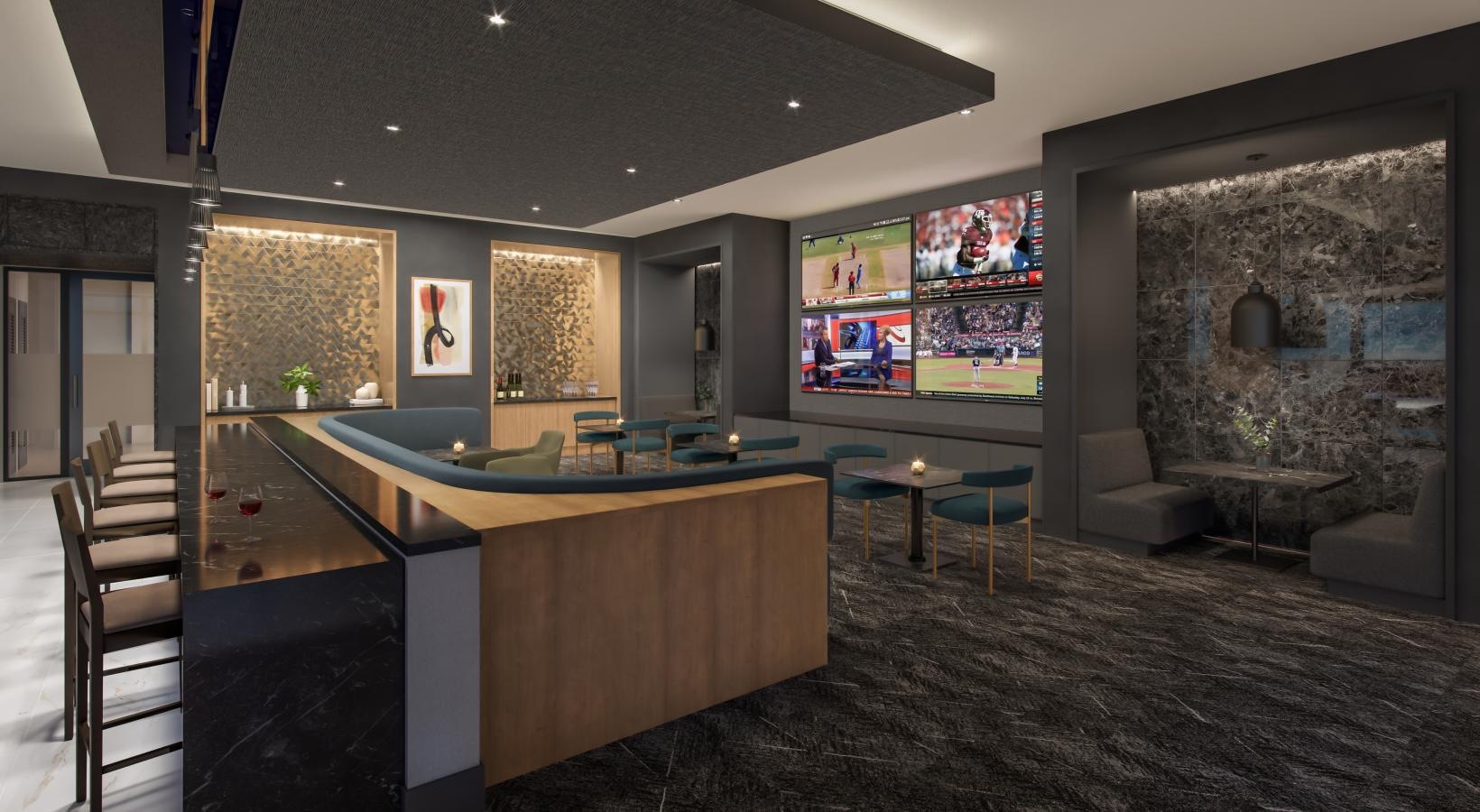 a room with a dining area and tvs