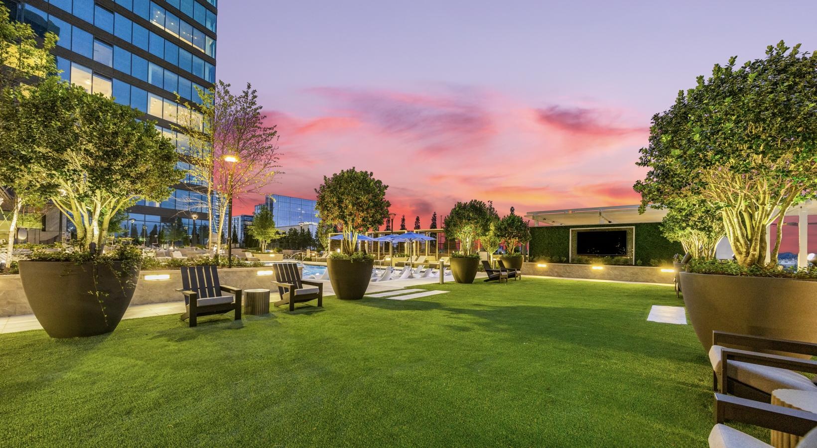 a lawn with chairs and tables