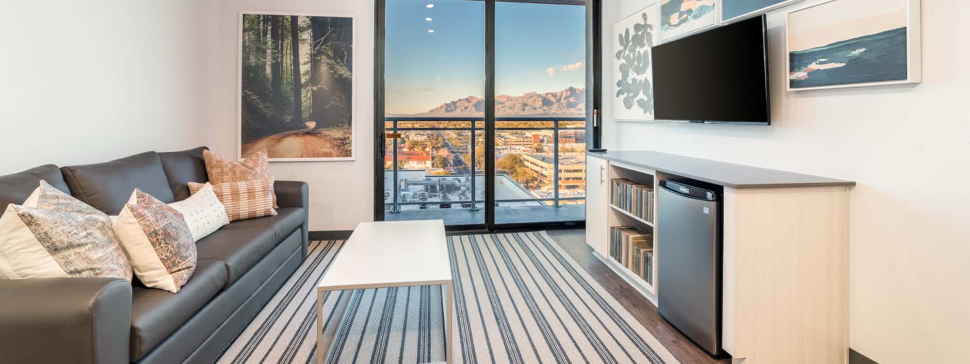 Living room with balcony access at Malibu in Tucson, Arizona