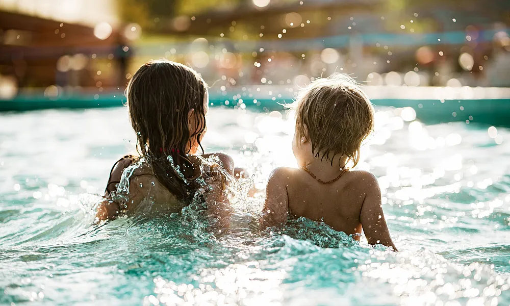 two kids in a pool