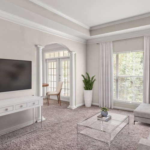 Living room with patio, oversized windows, seating, accent rug, and kitchen bar with stools