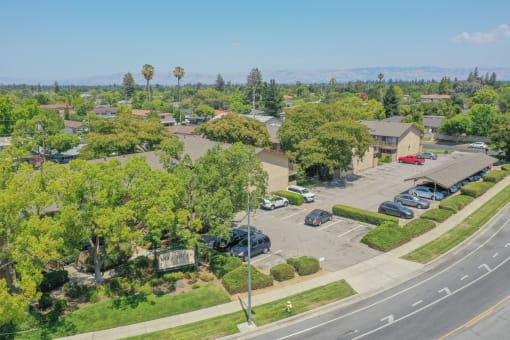 an aerial view of a neighborhood with houses and trees