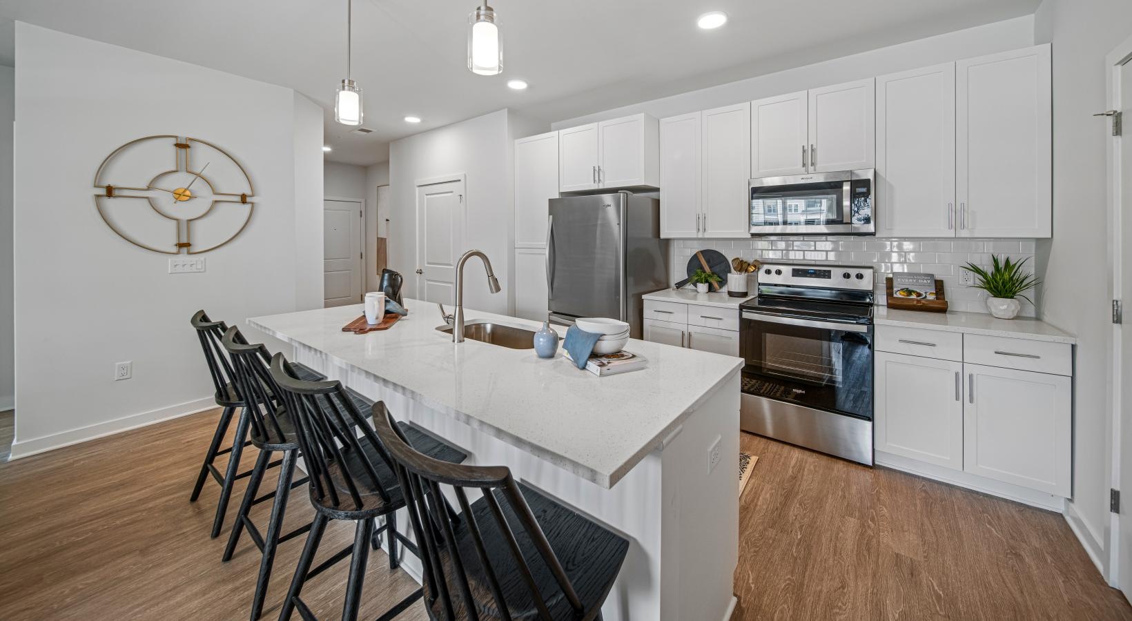 a kitchen with white cabinets