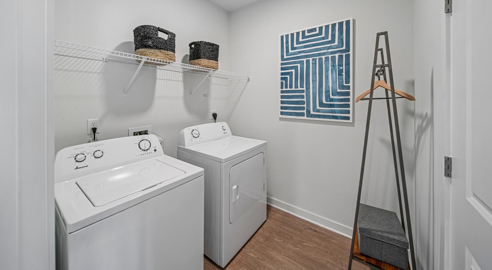 a laundry room with a washer and dryer