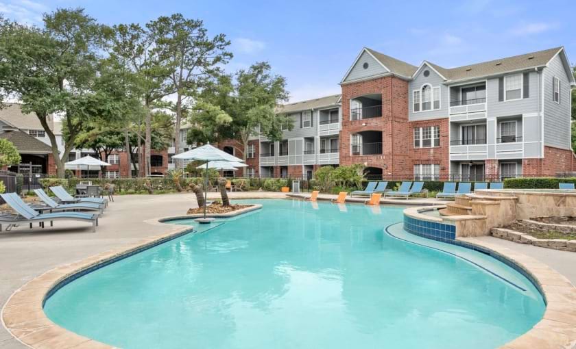 a swimming pool in front of a house