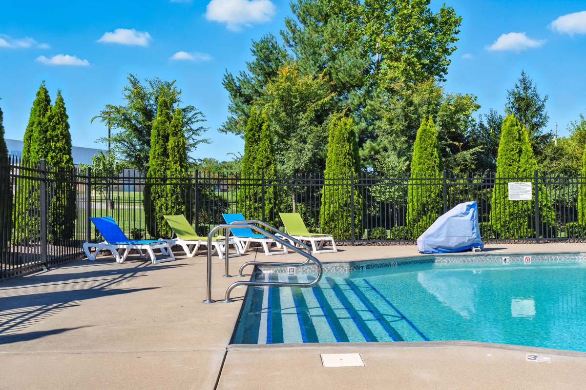 Residents swimming in a pool at Bristol Bluffs Apartments in Louisville, Kentucky