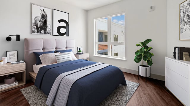 A bedroom with a queen-size bed, nightstand, dresser, and a window.