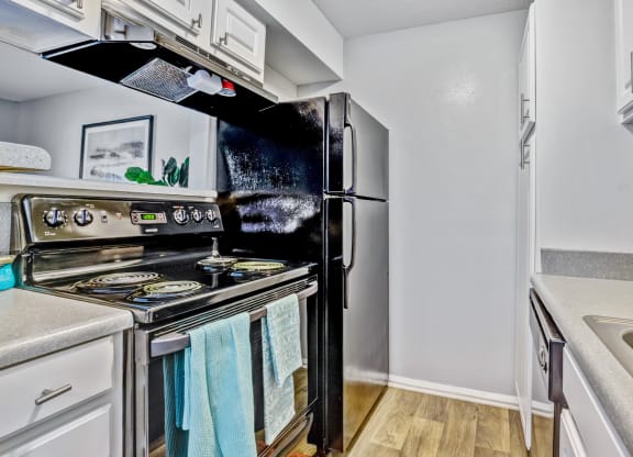 Kitchen with stainless steel appliances at Reserve at Providence apartments in Charlotte near Matthews, NC