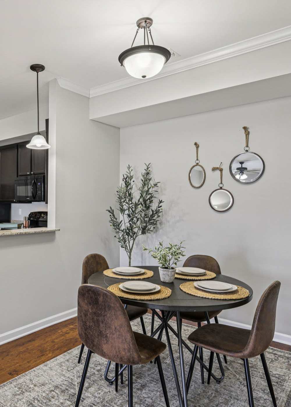 Dining area with connecting kitchen at Cumberland Trace Village Apartments in Bowling Green, Kentucky