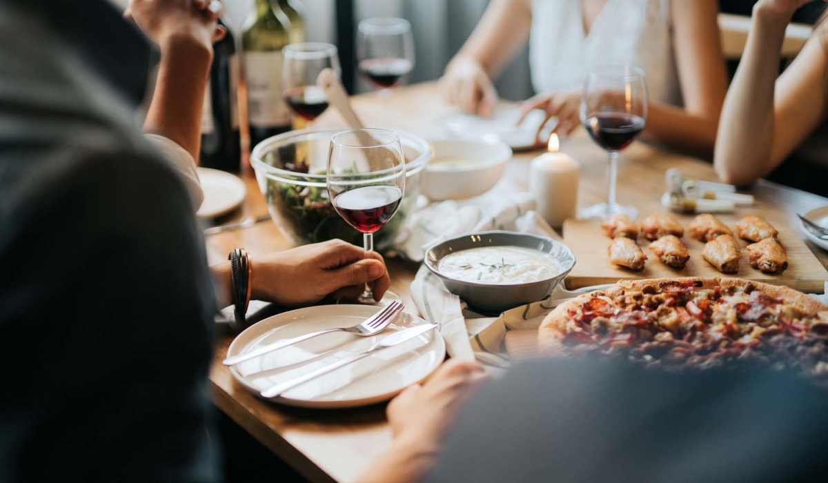 Friends having a meal at a restaurant near Cumberland Trace Village Apartments in Bowling Green, Kentucky