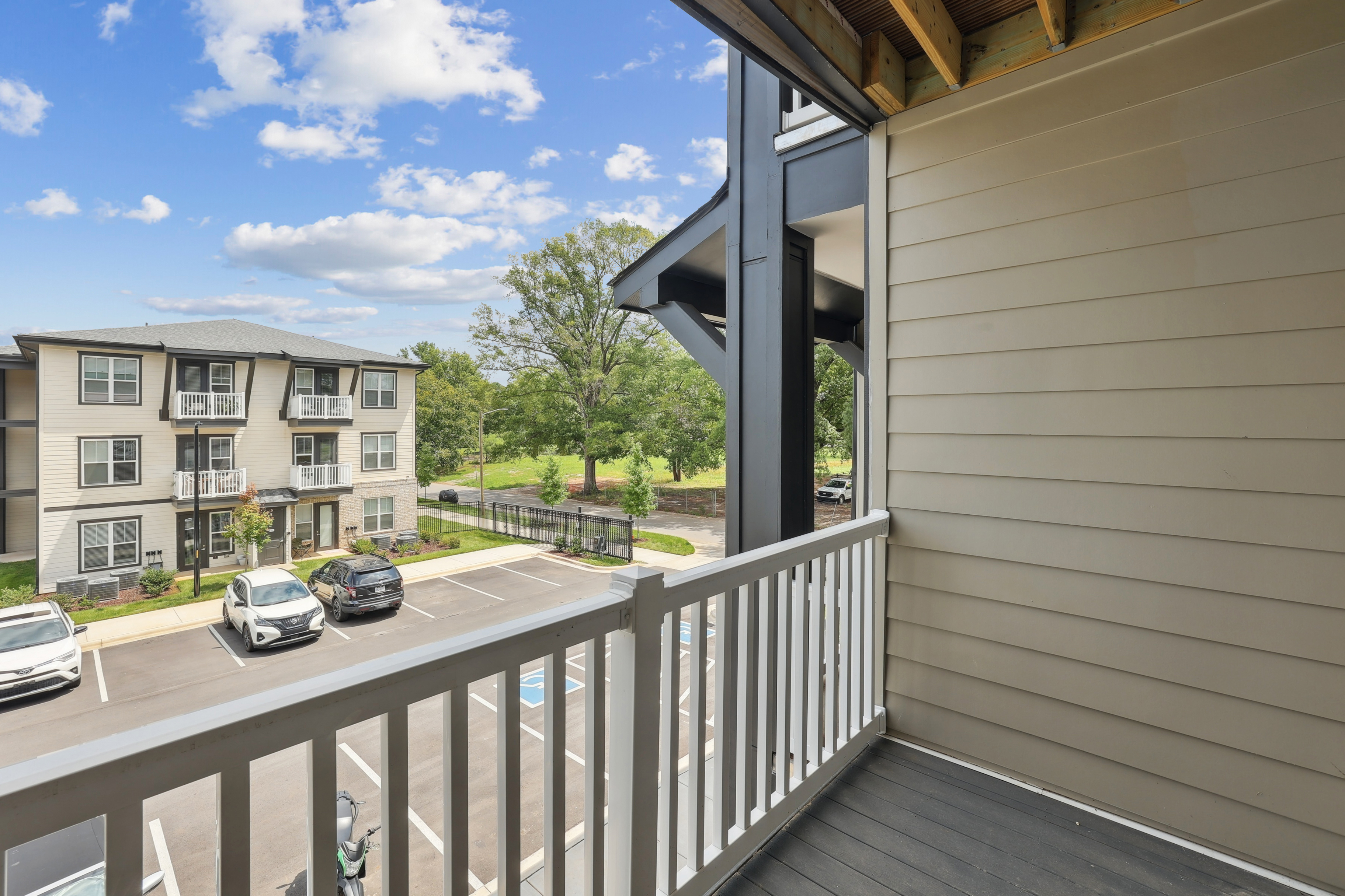 Exterior view of modern apartment buildings and parking at The Henry Apartments Charlotte NC
