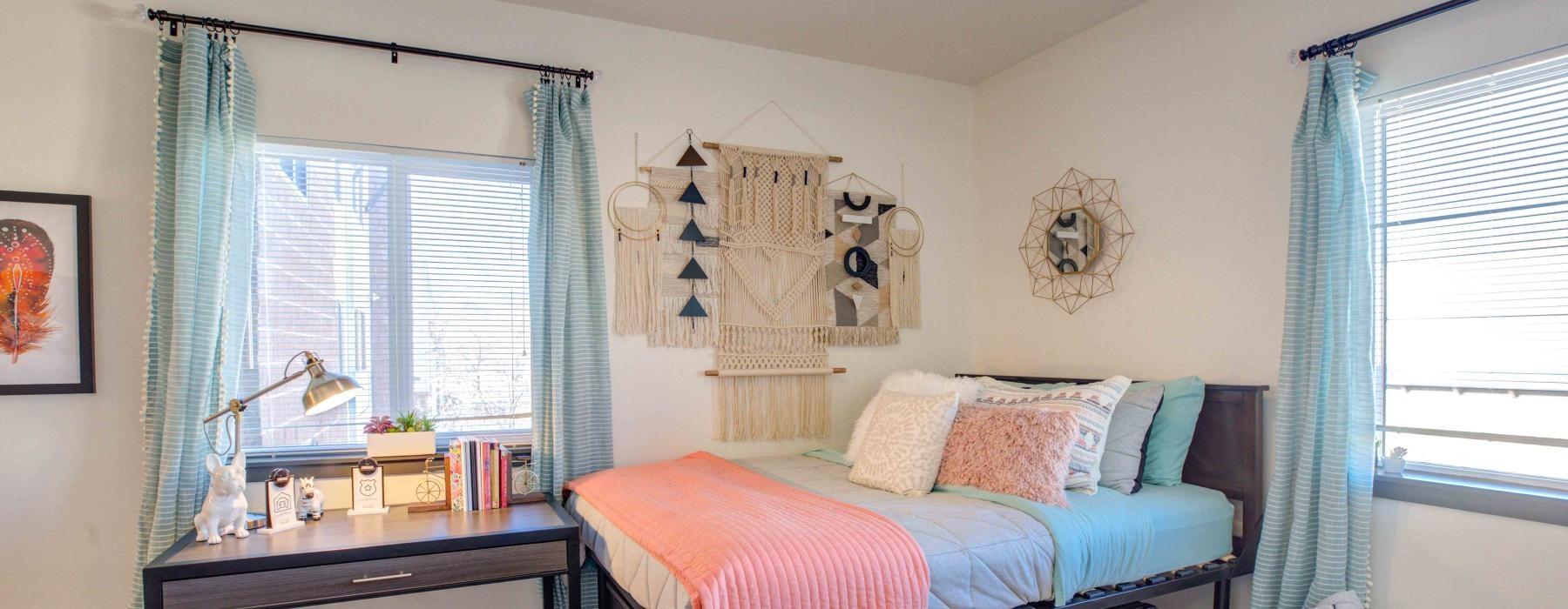 a bedroom with a bed and a table