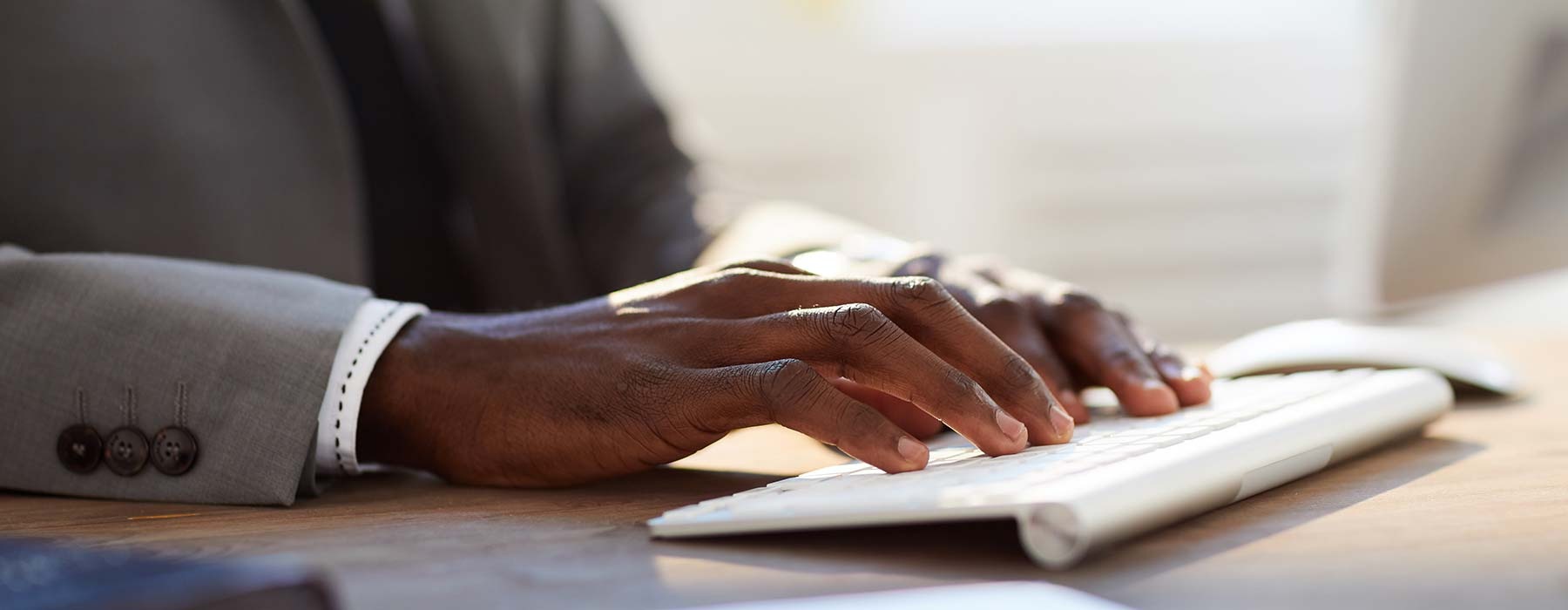 person typing on a keyboard