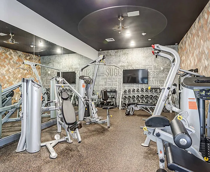 Fitness center with machines at College View apartments in Starkville, MS.