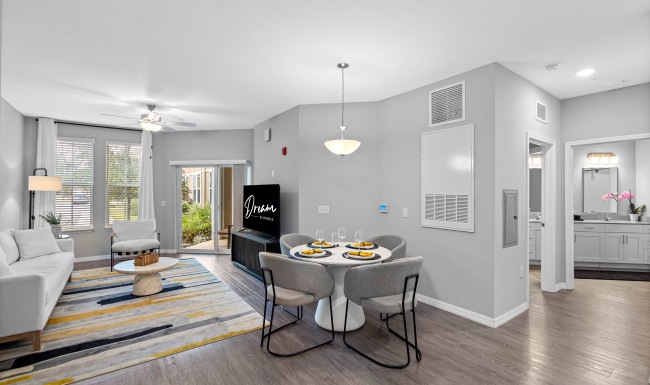 living area with couch, tv, and dining area