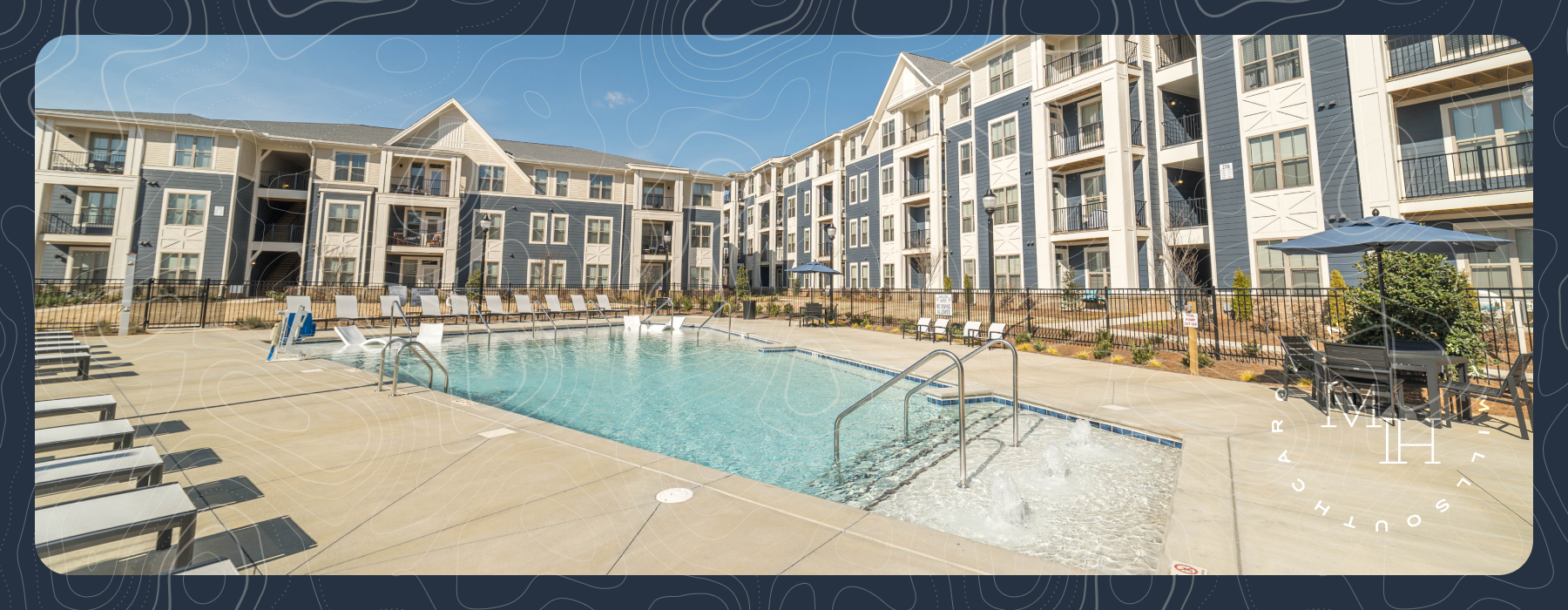 Outdoor pool with lounge seating at The Mill House apartments in Fort Mill SC 29715.