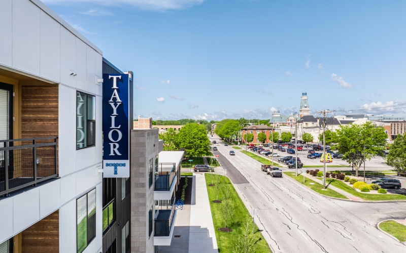 view of city with building sign in the foreground