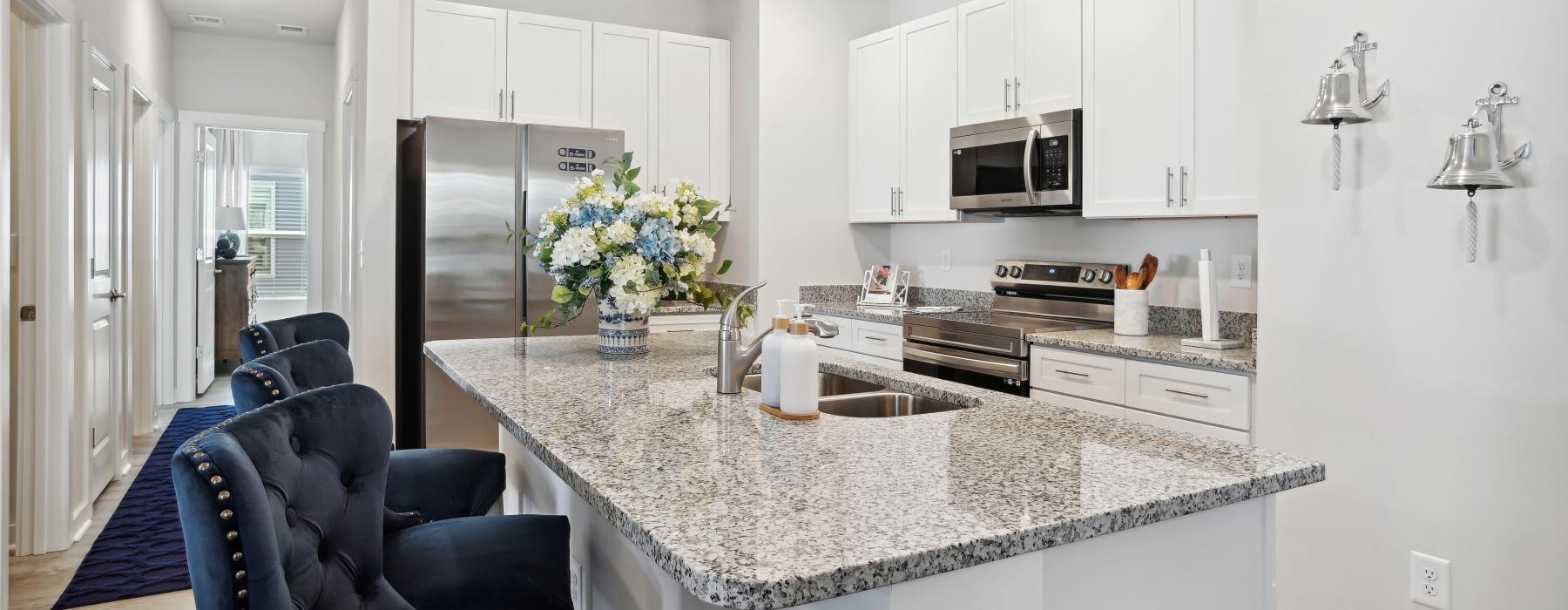 a kitchen with white cabinets