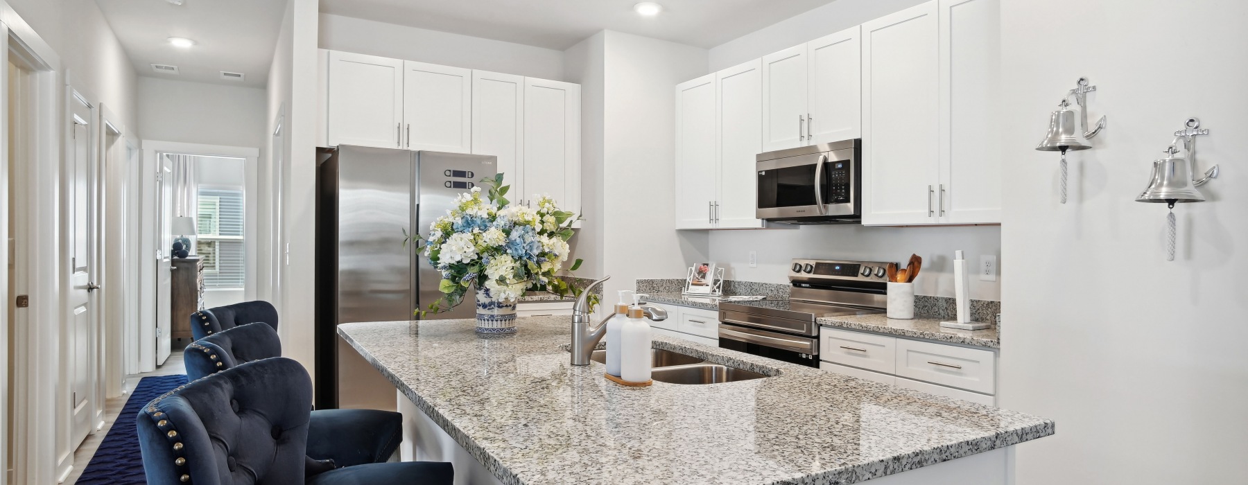 kitchen with a large island and white cabinets