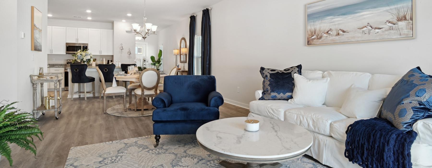 a living room with a couch and chairs