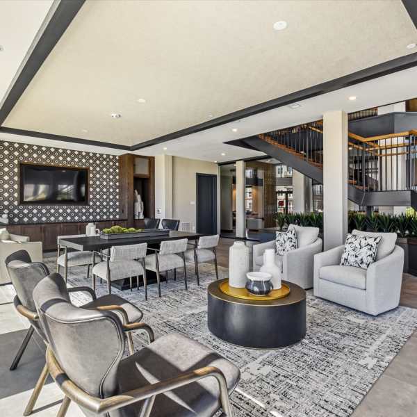 A modern lounge or bar area with seating and tables at The Palo in Fort Worth, Texas