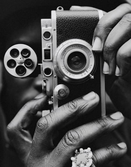 Resident using a film camera near The Palo in Fort Worth, Texas