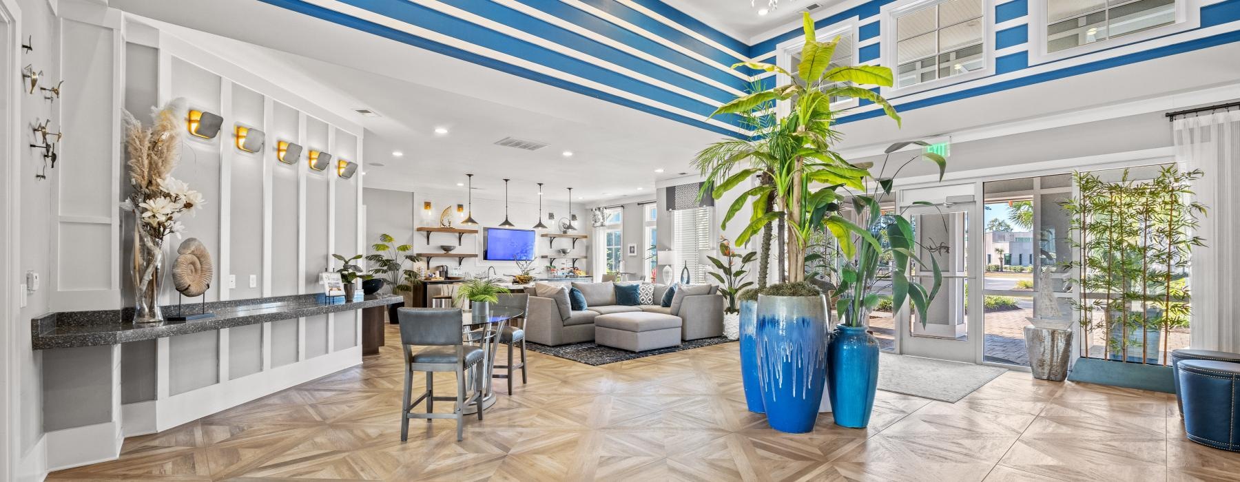 a large room with a large glass floor and a large white wall with a plant in it