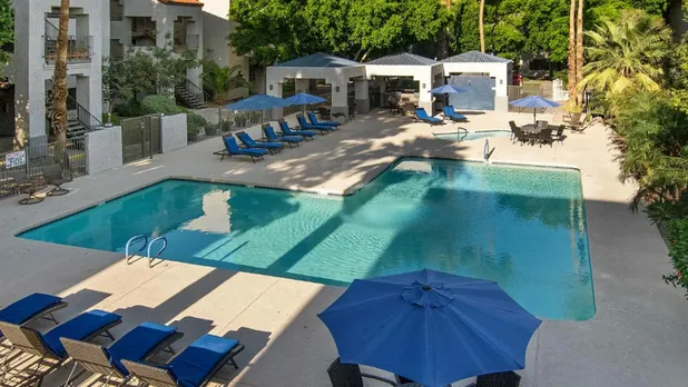 community pool and shaded grill area