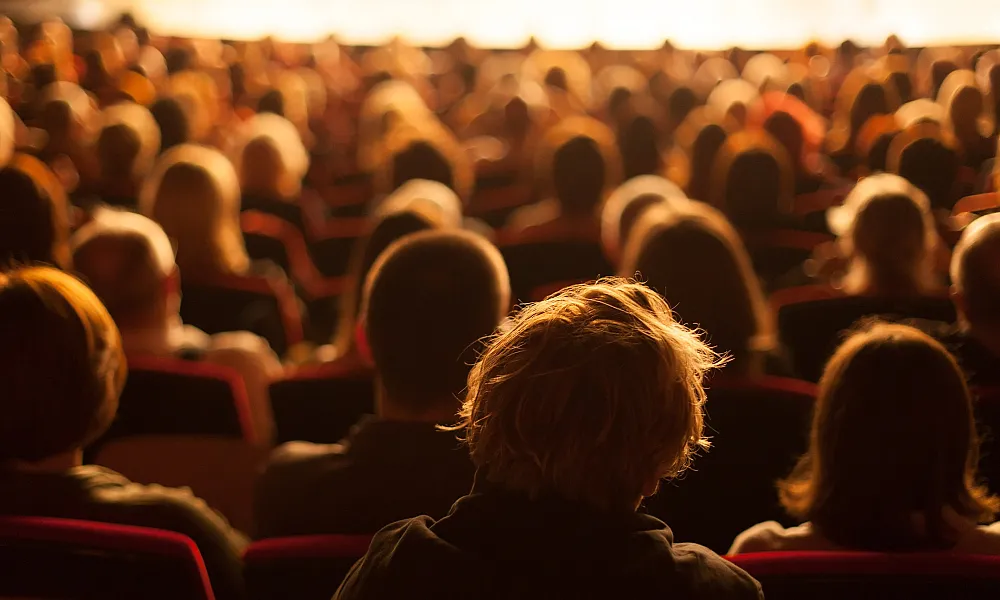audience watching a theater play