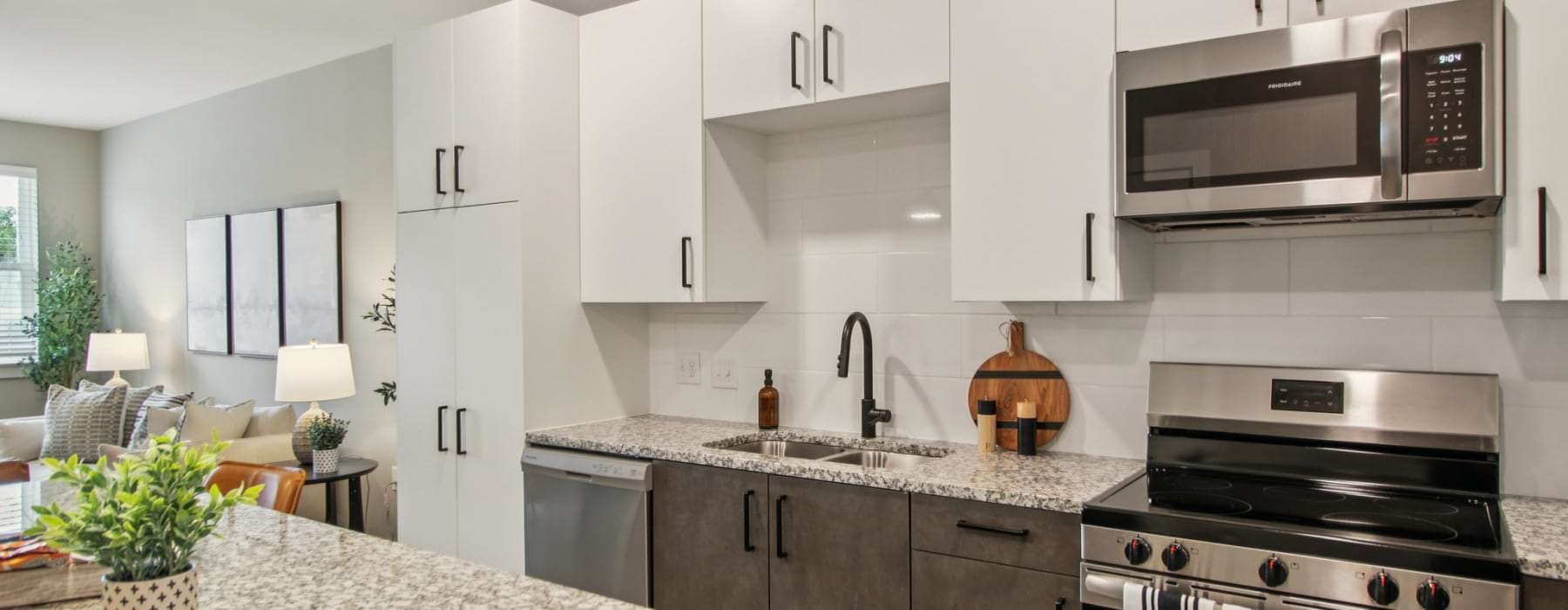 a kitchen with white cabinets