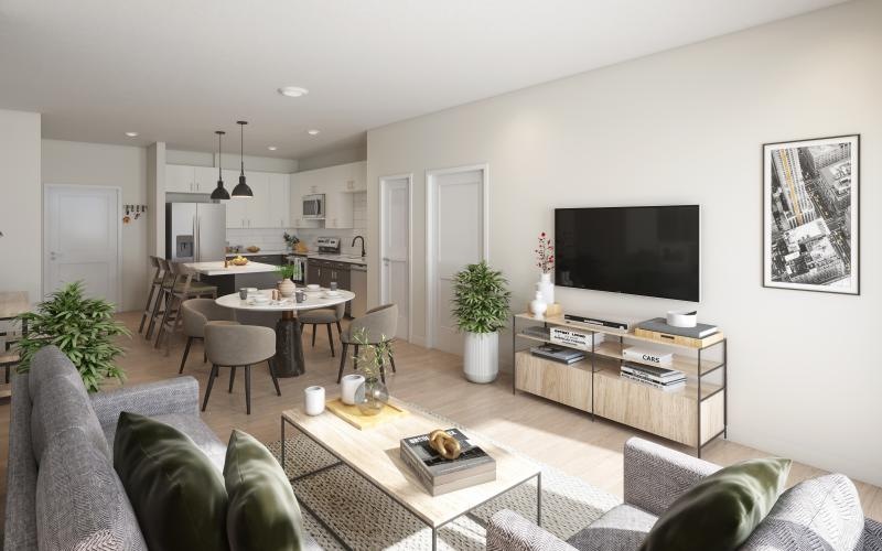 a living room with a tv and couches