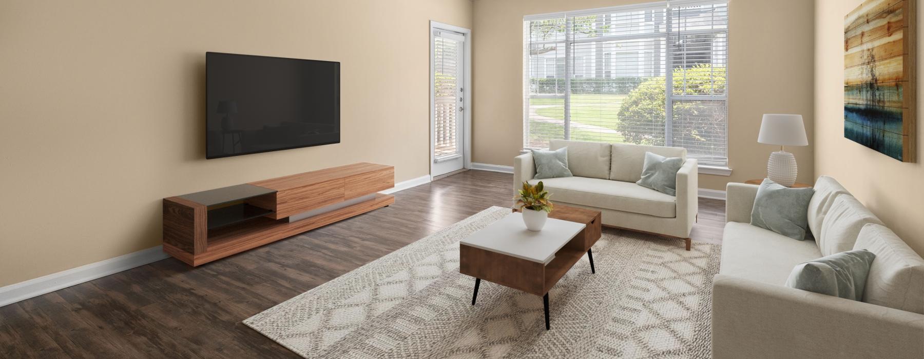 a living room with a tv and couches