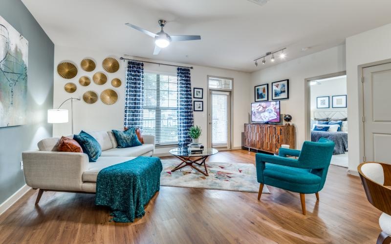 a living room with a couch and chairs