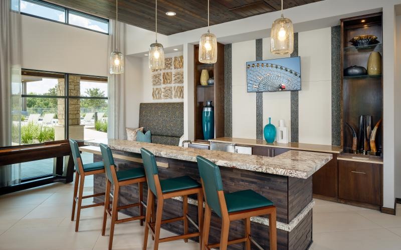 a kitchen with a table and chairs