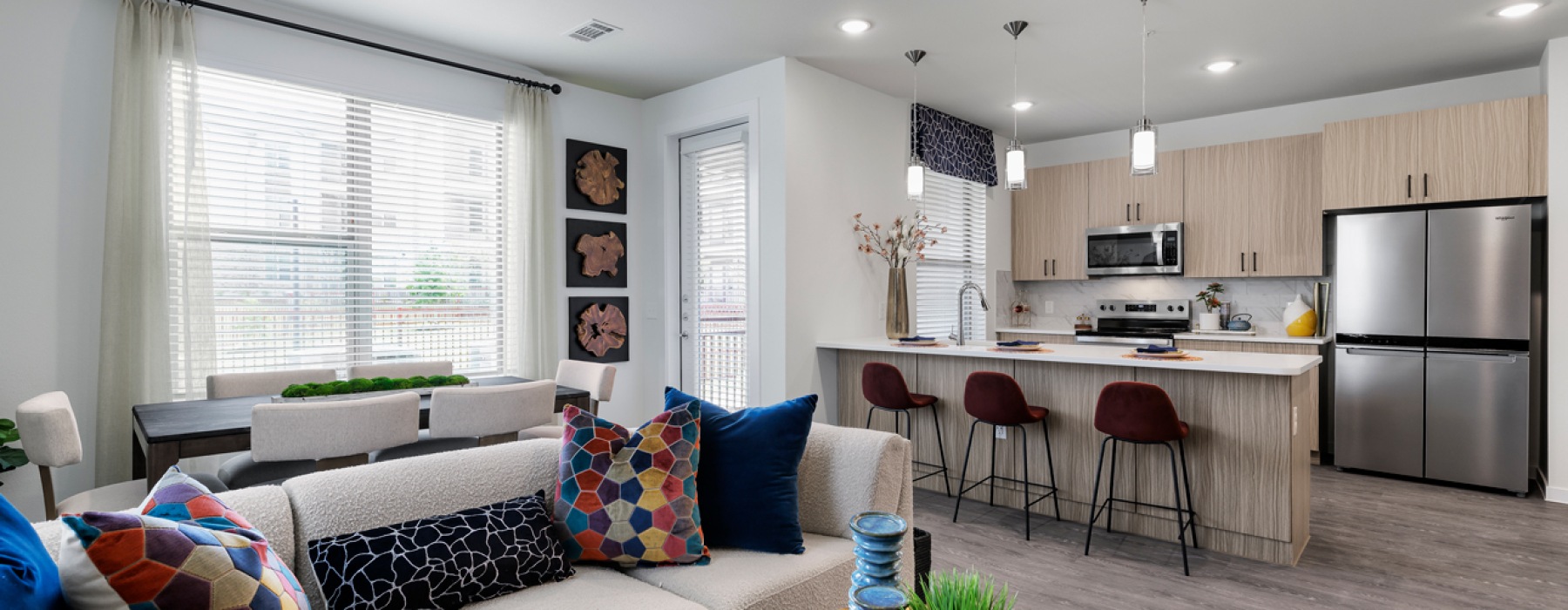 Open concept living room and kitchen at The Bower Pflugerville apartments for rent.